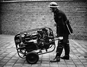 AFS worker with emergency appliance, WW2