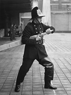 Firefighter taking part in a hose training drill
