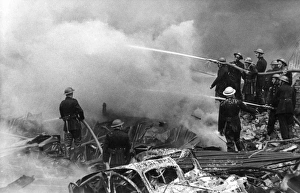 Firefighters in action after air raid, WW2