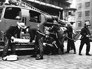Firefighters with fire engine and appliances, WW2