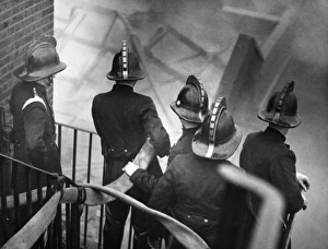 London firefighters at work on staircase, Carron Wharf