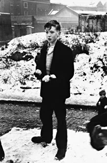 Boy with snowballs in Wapping